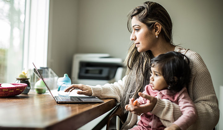 Woman at computer with child