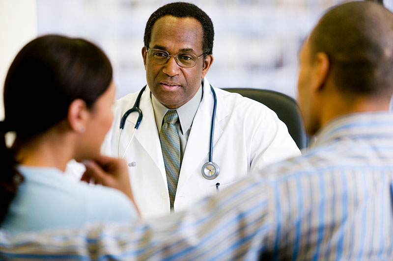 Doctor talking with patients